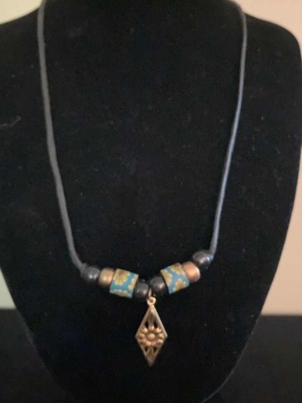 Black and Gold Beaded Necklace on Black Cord